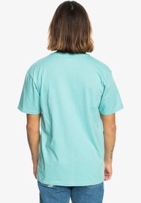 Light blue cotton t-shirt, crew neck, short sleeves, solid color, relaxed fit, smooth texture, minimalistic design, no visible branding.