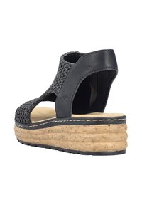 Czarne tkane skórzane sandały z korkową podeszwą, z wycięciami po bokach, wyściełanym wnętrzem i warstwowym projektem platformy.
