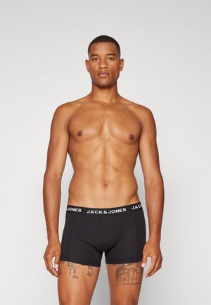 Schwarze Baumwoll-Boxershorts mit einem schlichten Design, ausgestattet mit einem elastischen Bund mit "JACK & JONES"-Logo, dargestellt an einem Modell.