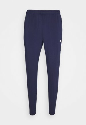 Marine joggers gemaakt van lichtgewicht, rekbaar materiaal met een elastische tailleband, zijzakken en een klein wit logo accent.