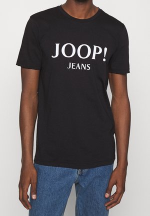 T-shirt en coton noir à manches courtes, avec un grand texte blanc "JOOP! JEANS" sur le devant. Texture lisse et coupe classique.