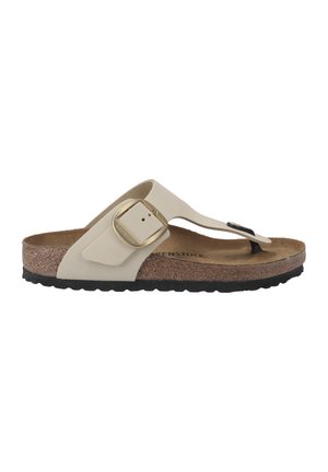 Light beige thong sandal with a textured cork footbed, adjustable strap, gold hardware, and black rubber sole. Classic and functional design.