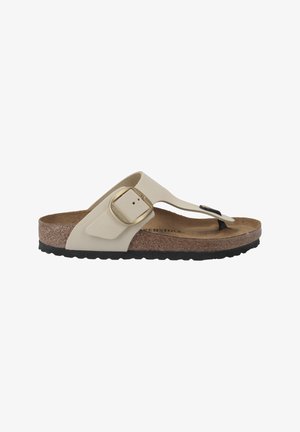 Light beige thong sandal with a textured cork footbed, adjustable strap, gold hardware, and black rubber sole. Classic and functional design.