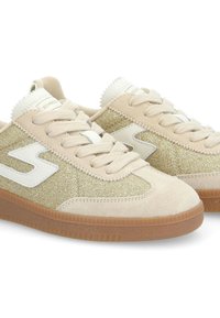 Beige suede sneakers with glitter accents, white tongue and logo, round toe, and gum rubber sole. Features lace-up closure and textured fabric.
