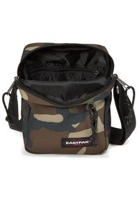 Borsa a tracolla con motivo camouflage realizzata in tessuto resistente; dotata di chiusura con zip, tracolla regolabile e tasche interne per un'organizzazione ottimale.
