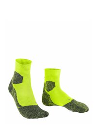 Neonowożółte skarpetki z czarnymi, teksturowanymi akcentami. Żebrowany wzór, długość do połowy łydki, wzmocnione palce i pięty, odpowiednie do aktywnego noszenia.