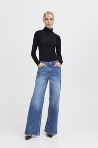 Black long-sleeve turtleneck paired with wide-leg blue denim jeans. Smooth fabric and light blue wash with subtle fading, featuring front pockets.