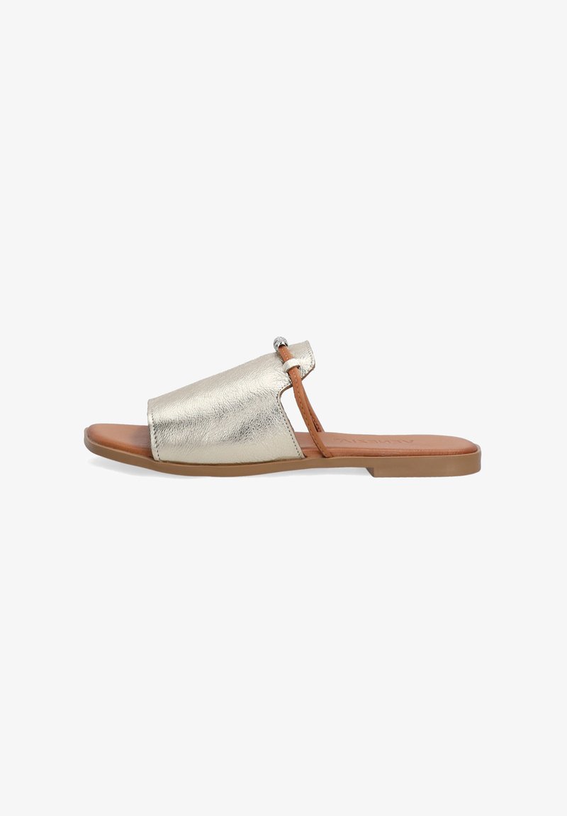 Gold metallic slide sandal featuring a structured strap, open toe design, brown sole, and a decorative silver accent on the strap.