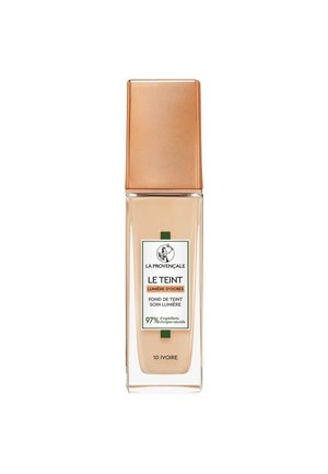 Flacon en verre de fond de teint liquide La Provençale Le Teint teinte 10 Ivoire avec un bouchon doré mat et une étiquette blanche.