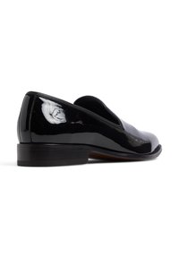 Schwarze Lackleder-Pantolette mit glatter Oberfläche, abgerundeter Zehenpartie, niedrigen Absatz und feinen Stichdetails entlang der Kanten.