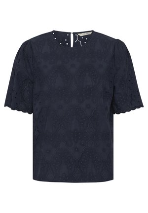 Marineblå kortærmet top med broderet design, bølgede kanter og ryg med nøglehul og knaplukning. Fremstillet af letvægtigt stof.