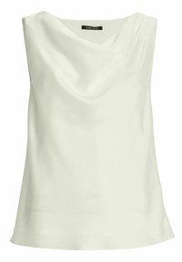 Blouse blanche sans manches avec un col drapé et une texture de tissu lisse, étiquetée "SWING" à l'intérieur du col.