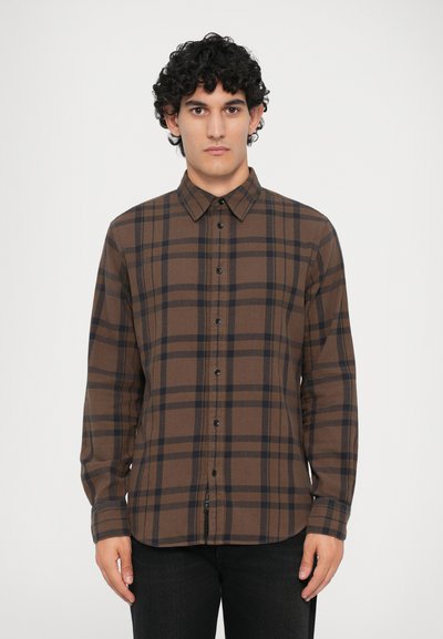 Brown plaid shirt features a button-up design, spread collar, long sleeves, and black buttons on a soft fabric, with contrasting dark stripes.