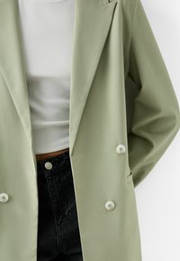 Bershka Kort kappa / rock - green