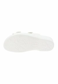 Suela de calzado de goma blanca con un patrón de agarre texturizado y una ligera curvatura. Presenta un sutil logotipo en el talón. Superficie plana y lisa.