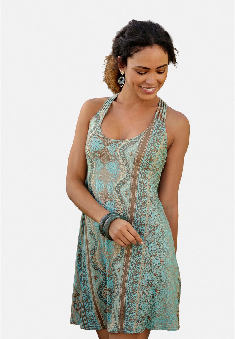 Haljina bez rukava s tirkiznim i smešnim paisley uzorkom, opuštenog kroja i dizajnom pletenih naramenica. Naglašena narukvicom.