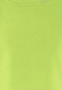 Limoengroen, gladde textuur, sweatshirt met ronde hals en geribbelde manchetten en onderrand. Eenvoudig ontwerp, effen kleur zonder patronen of accenten.