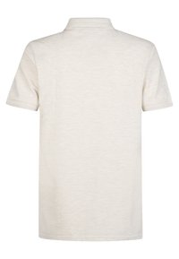 Kortärmad polotshirt i ljusbeige, tillverkad av mjuk bomullsblandning. Har en klassisk krage och rak nederkant, med subtil textur.