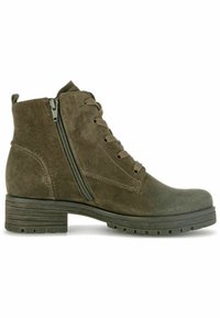 Bottines en daim marron avec lacets et fermeture éclair latérale. Talon carré et semelle en caoutchouc texturé pour une bonne adhérence. Capuchon de pointe lisse avec une forme arrondie.