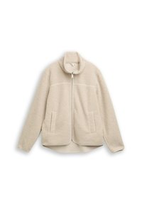 Veste en polaire beige avec un col haut, fermeture éclair et deux poches avant, présentant une texture douce et un ourlet légèrement arrondi.