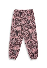 Pink camouflage pants with black graphic prints, featuring an elastic waistband and gathered ankles. Material appears soft with a relaxed fit.