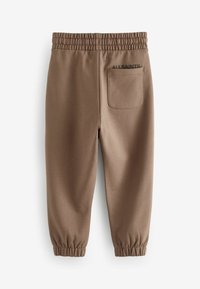 Marron sukhapajama avec ceinture élastique, jambes resserrées et une poche arrière comportant le texte "ALLSAINTS" en noir.