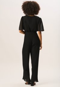 GINI LONDON ANGLE SLEEVES PLEATED - Jumpsuit - black