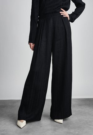 CORA - Pantalones - black