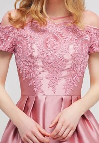 Pink satin dress featuring intricate floral embroidery on the bodice, off-shoulder design, and a pleated skirt.
