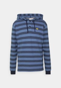 Blårandig hoodie med knäppbar krage, med en gul logotyp på bröstet, tillverkad av mjukt tyg med texturerade ränder.