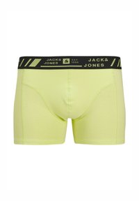 Neongele herenboxershorts met een zwarte tailleband met het logo "JACK & JONES" en gestreepte accenten, gemaakt van een rekbare stof.