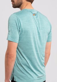 Rukka YLIKIIKA - T-shirt de sport - grün