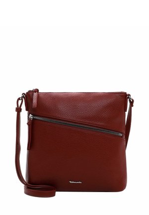 Red leather crossbody bag with a textured finish, adjustable strap, front zipper pocket, and metal hardware. Compact square shape.