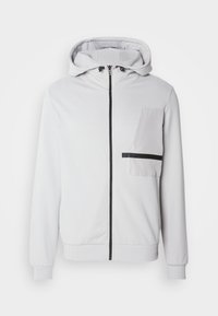Light gray zip-up hoodie with a drawstring hood, front pocket, and black zipper accents. Made of soft, textured fabric with ribbed cuffs.