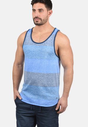 Blue striped tank top with varying shades of blue and gray. Features a round neckline and contrasting dark blue trim. Lightweight material.