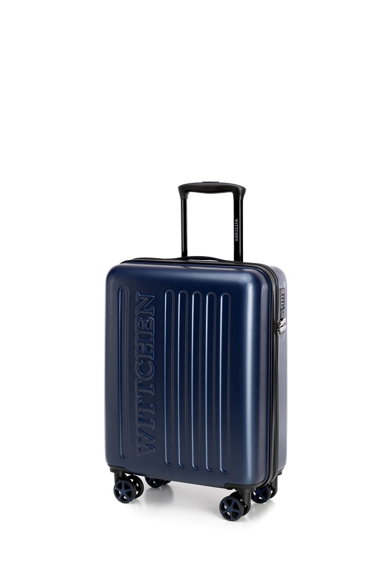 Valigia rigida blu navy con scanalature verticali, logo "WITTCHEN" in rilievo, manico estraibile, quattro ruote e chiusura a zip.