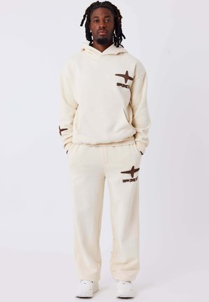 JOGGING BREAKOUT - Pantaloni - crème camel