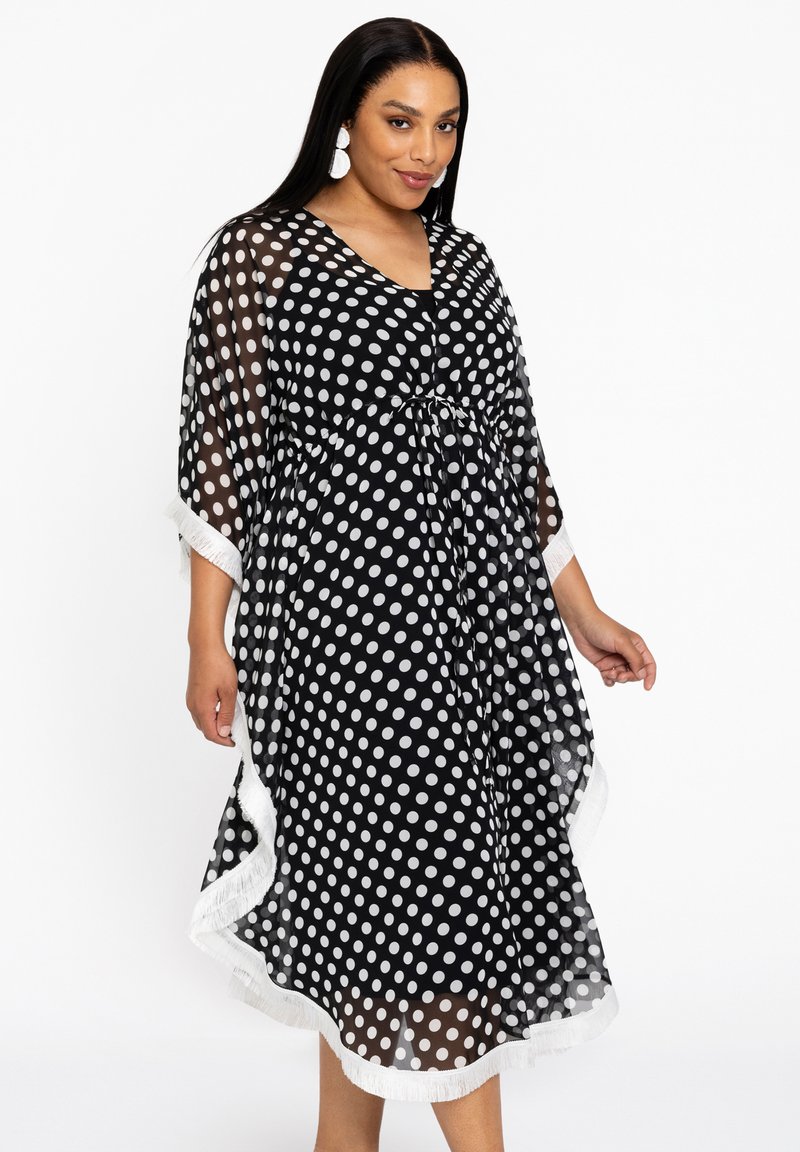 Schwarzes Polka-Dot-Kaftan aus transparentem Stoff, mit einem Kordelzug in der Taille, weißen Akzenten und ausladenden Ärmeln. Entworfen für eine fließende Silhouette.