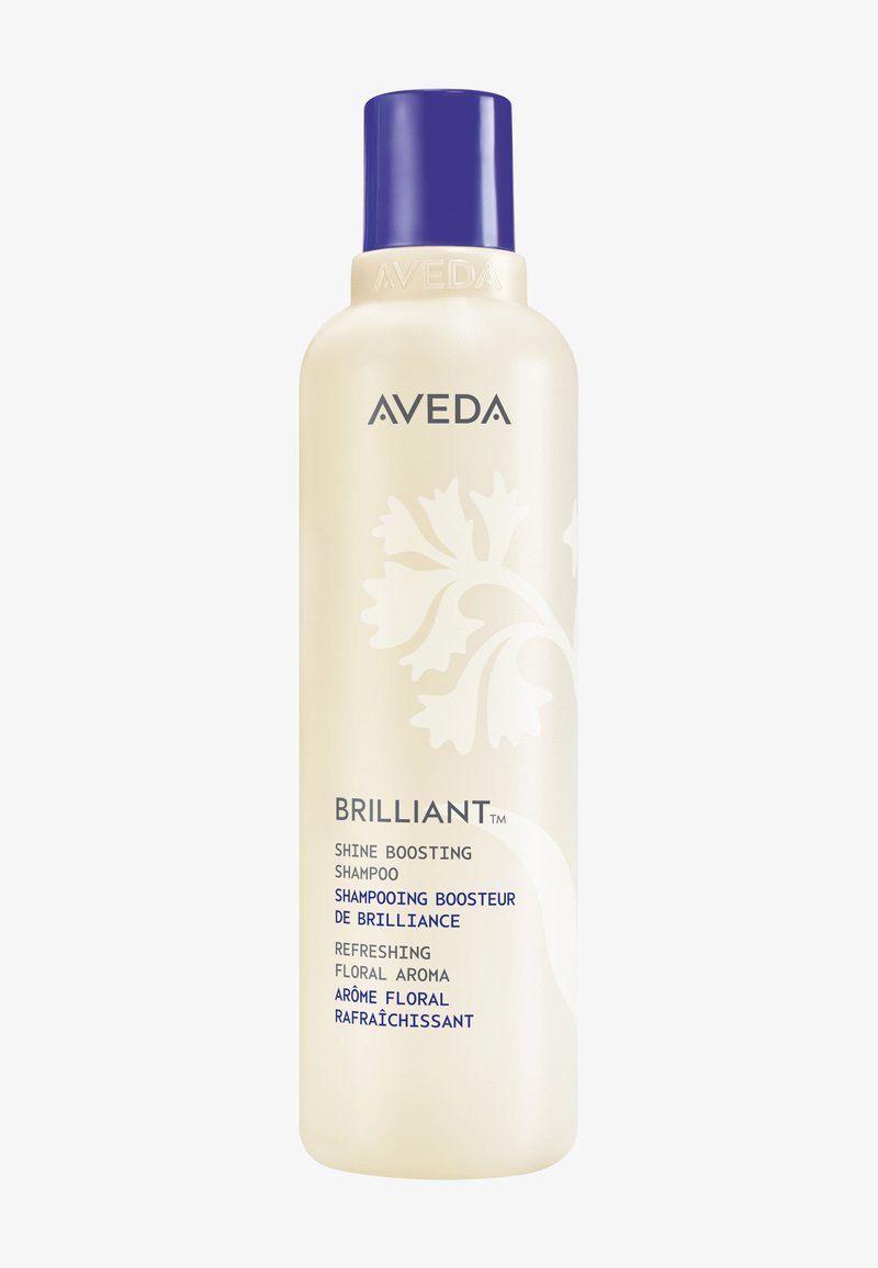 Flacon de shampooing Aveda Brilliant Shine Boosting avec design floral, bouchon violet, étiqueté comme arôme floral rafraîchissant.