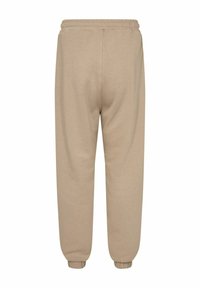 Beige Sweatpants mit elastischem Bund und Bündchen. Der Stoff hat eine glatte Textur und bietet eine lockere Passform. Rückansicht gezeigt.