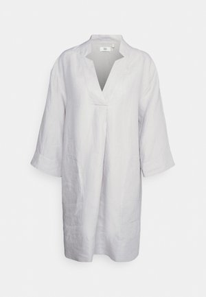 Light gray linen tunic with a V-neck, three-quarter sleeves, and side pockets. Simple design with subtle stitching details.