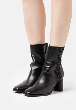 High heeled ankle boots - black