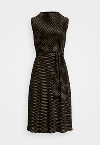 Black dress with sleeveless design, featuring a patterned texture of small gold dots, a fitted waist, and a tie detail.