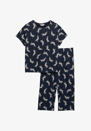 Tmavě modrý bavlněný pyžamový set obsahující tričko s krátkým rukávem a dlouhé kalhoty, obojí s opakujícím se vzorem bílých koček. Měkká, lehká tkanina.