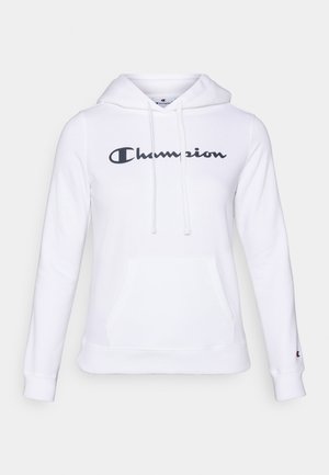 Hvit hettegenser laget av bomullsblanding, med en lomme foran og snor i hetten. Svart "Champion"-logo trykt på forsiden. Myk tekstur.