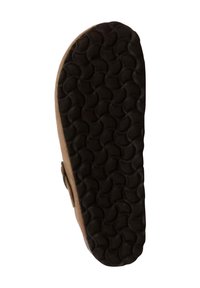 Brown sandal sole features a textured black rubber bottom with circular patterns, providing grip and durability.