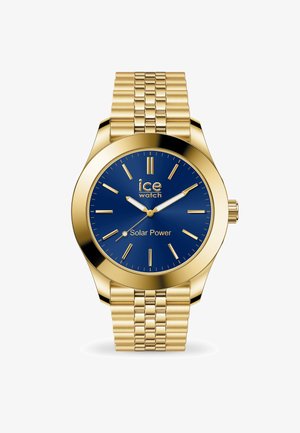 Złoty zegarek solarny z niebieską tarczą, stalową siatkową bransoletą, wyraźnymi znacznikami godzin oraz prostą koronką. Tekst: "ice watch Solar Power."