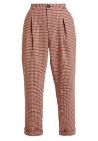 Rutig byxor i nyanser av orange och svart, med veck, knappstängning och upplagda fållar. Tillverkade av lättviktsmaterial.