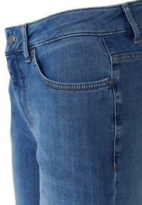 Dark blue denim jeans with a fitted design, featuring gold stitching, two front pockets, and a small brand logo on the rear pocket.