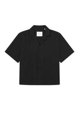 Black short-sleeve shirt with a button closure, flat collar, smooth texture, and subtle pattern on fabric, labeled "LES DEUX" inside.